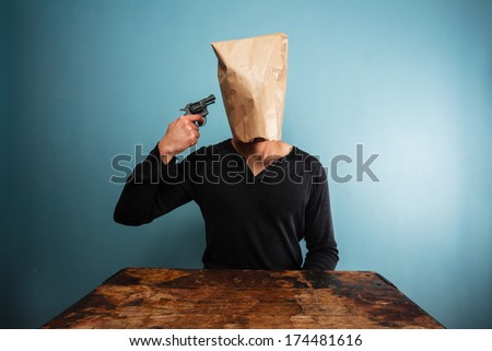 Man with bag over head committing suicide