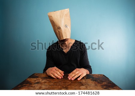 Stupid man with bag over his head