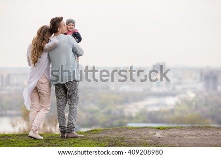 Happy young family on a background of the city