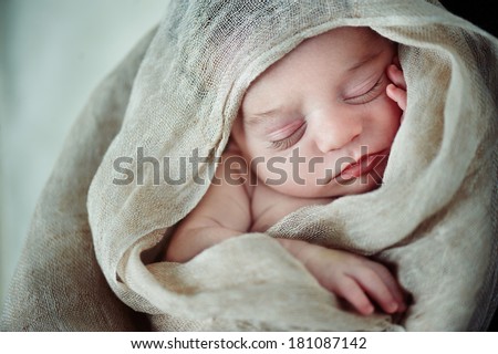 Sleeping Newborn Baby wrapped in blanket