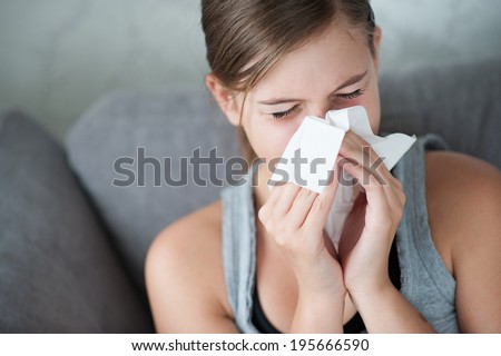 Child cold flu illness tissue blowing runny nose
