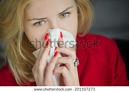 Allergy or cold flu illness tissue blowing runny nose