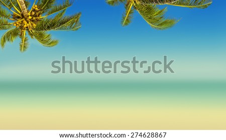 Vintage effect (retro style). Coconut palm trees, ocean and blurry beach. Tropic island background. Panoramic view.