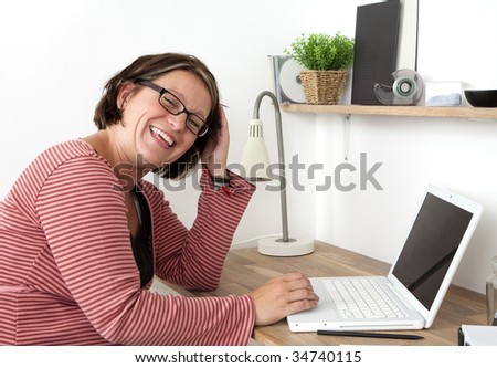 Woman working in a cozy workspace at home