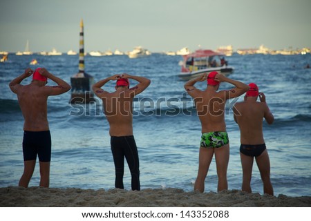 PERTH, WESTERN AUSTRALIA - FEBRUARY 23 : Swimmers start the Rottnest Channel Swim on 23 February, 2013 at Cottesloe Beach, Perth. The race is one of the world's largest open water swimming events.