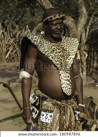 KWAZULU-NATAL, SOUTH AFRICA - AUGUST 18: Zulu chief of village wearing traditional clothing on August 18, 2004 in KwaZulu-Natal. Zulus wear such attire for ceremonies and cultural celebrations.
