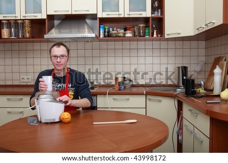 Man in a kitchen with food processor