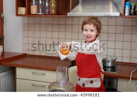 Smiling boy, making food