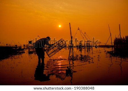 Silhouettes fishing net fishing Thailand.