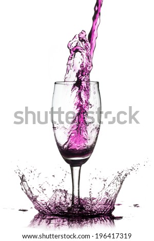 purple cocktail splash from glass on white background.