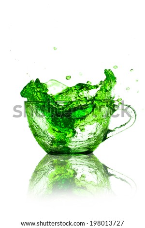 cream soda splash from cup isolated on white background.