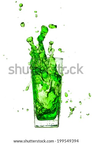 a cream soda splash water out of a glass on a white background.