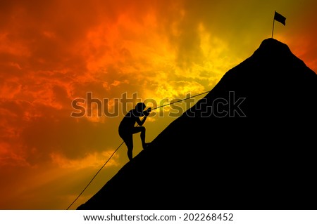 Silhouettes of men who try climbing.