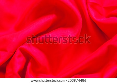 Wrinkled wrinkled red cloth background.