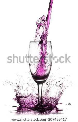 Purple splash out drink from glass on a white background.