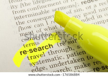 The Word Research Highlighted in Dictionary with Yellow Marker Highlighter Pen.