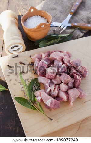 pieces of the cut crude meat on a table
