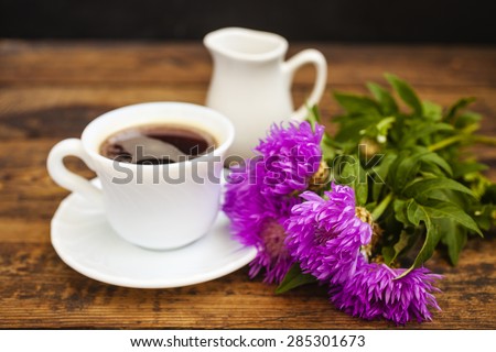 flowers and tea on a table, selective focus on flowers