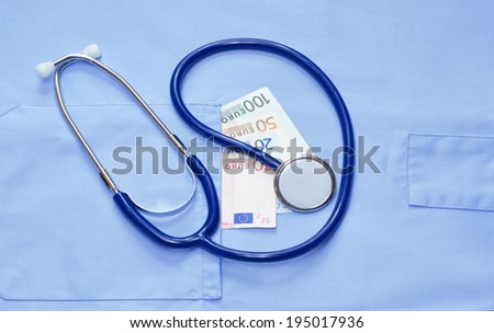 Money in the pocket of a medical uniform and stethoscope
