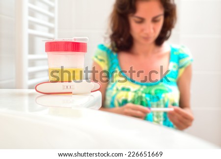 Young woman doing pregnancy test