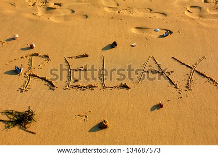 Relax Word In Sand at Beach