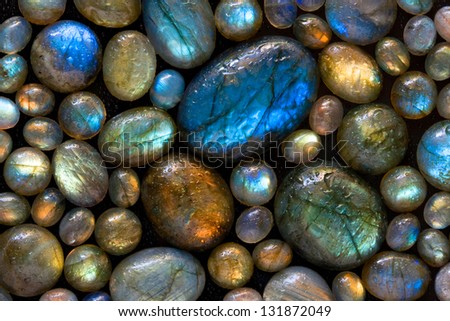 Texture Of Wet Colorful Labradorite Gem Stones.
