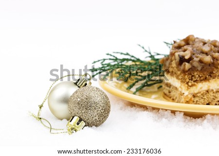 Christmas greeting card, Christmas color balls and cake on white background with copy space