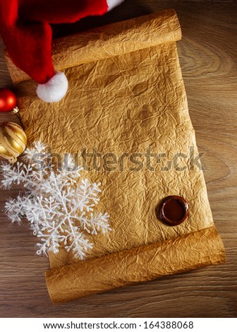 Letter for Santa with christmas hat on wood background