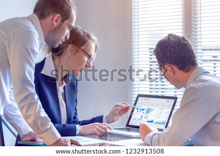 Digital marketing analyst people working on internet advertisement campaign analytics data on key performance indicator dashboard, metrics and KPI on computer screen, business strategy, investment