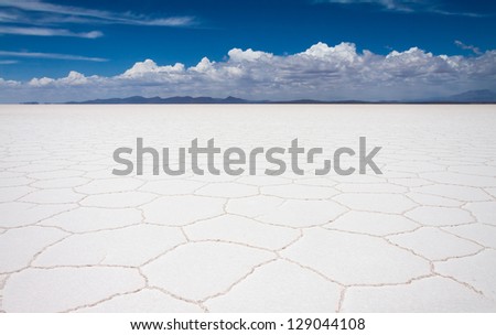 Panoramic view of Uyuni salt flats with white clouds, Bolivia