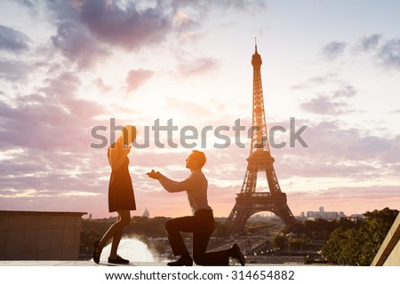 Romantic marriage proposal at Eiffel Tower, Paris, France