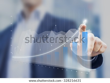 Financial charts showing growing revenue on touch screen
