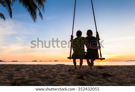 Couple on paradise beach resort sharing honeymoon