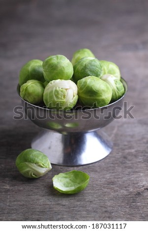 Brussels sprouts in a metal vase