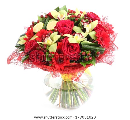 Flower arrangement in glass, transparent vase: red roses, orchids, red gerbera daisies. Isolated on white background. Floristic composition, design a bouquet, floral arrangement.