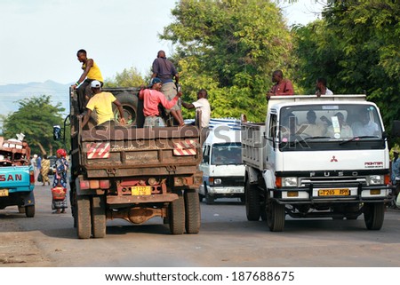 Makuyuni, Arusha, Tanzania - February 13, 2008: Transportation of passengers, African men make the trip back of a truck, people in open back of a truck