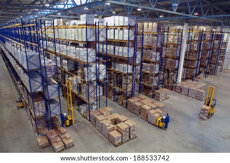 St. Petersburg, Russia - November 21, 2008: Interior warehouse storage, vertical storage, pallets on shelves overhead racks, interior large warehouse with freight stacked high.