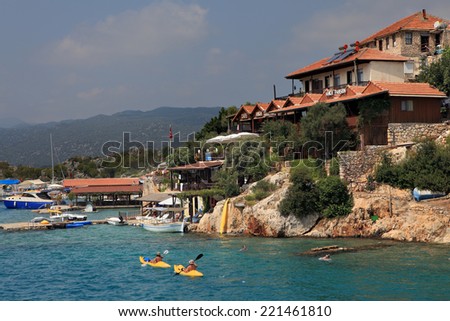 Antalya, Turkey - August 28, 2014: Simena village on the Turkish island of Kekova, Tourists kayaking.