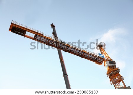St. Petersburg, Russia - October 29, 2014:  The erection of a tower crane. Section of tower crane assembly, mounting counterjib to the tower mast.