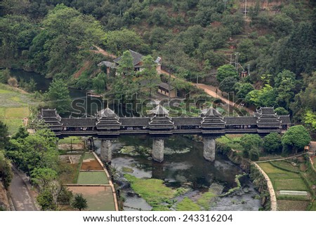 Sanjiang, Guangxi Province, China - April 6, 2010:  wind and rain Bridge, Guangxi Autonomous Region, the old wooden bridge, Attractions Village Chengyang, situated near the city of Sanjiang.