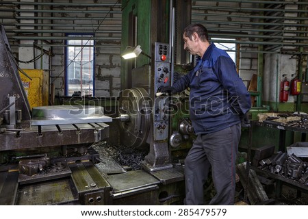 St. Petersburg, Russia - May 21, 2015: Turning Workshop Plant metal structures, work machine tool operator controls the process of drilling a steel part on a horizontal boring machine.