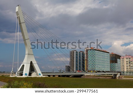 St. Petersburg, Russia - July 9, 2015: guyed steam pipe bridge, heating pipes pipeline, cable-stayed crossing
