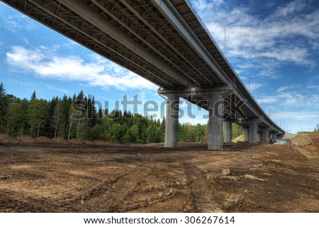 Saint Petersburg, Russia - August 7, 2015: Bridge spans of the overpass on the highway in the Russian forest.