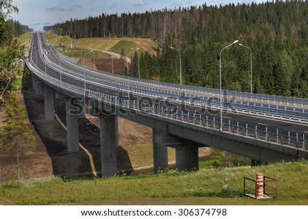 Saint Petersburg, Russia - August 7, 2015: The steel motor road bridge on reinforced concrete piers, four-lane high-speed motorway, highway Sortavala, Leningrad region.