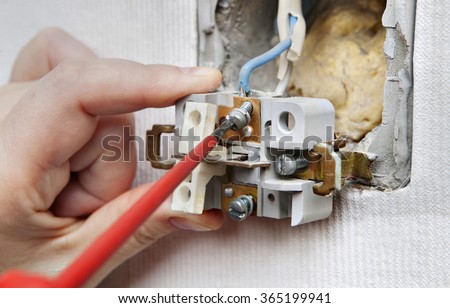 Repairing household power, dismantling faulty wall switch light, changing a light switch.