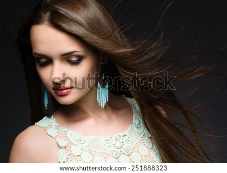 Portrait of a beautiful brunette with windy hair