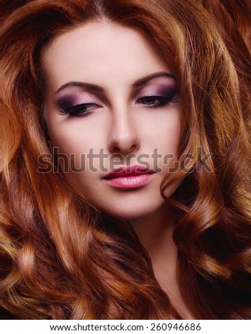 Portrait of a beautiful red haired woman with beautiful makeup
