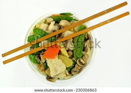 Moo Goo Gai Pan in a bowl with chop sticks.