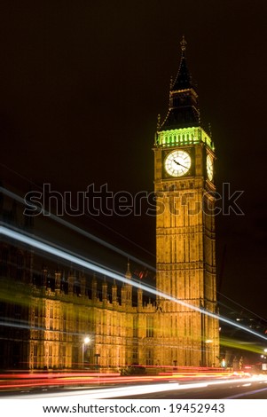 Westminster Tower/Big Ben at night from Westminster Bridge with light trails from passing vehicles