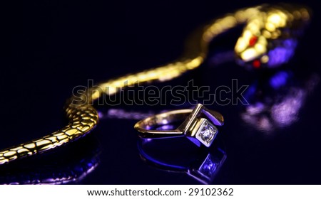 golden snake with ruby eyes  and dimond ring